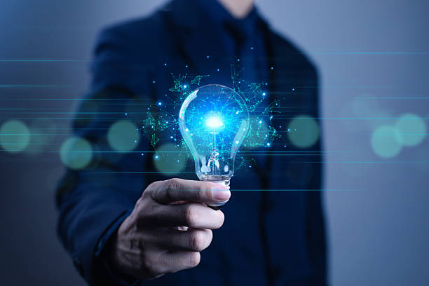 istock Businessman hand holding glowing light bulb with digital network connection, symbolizing innovation, technology, creative idea, future vision, business growth, smart solution, and global connectivity. 2234616367