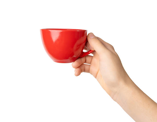 istock Hand Holds Cup Isolated, Empty Red Cup in Hands, Coffee Mug, Teacup, Hot Beverage Mockup 2234617597