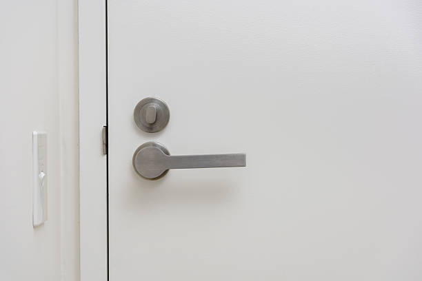 istock Modern White Door with Brushed Metal Handle and Lock 2234619315