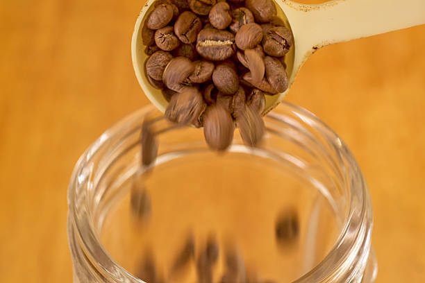 istock A scene of putting coffee beans into an electric grinder. 2234619664