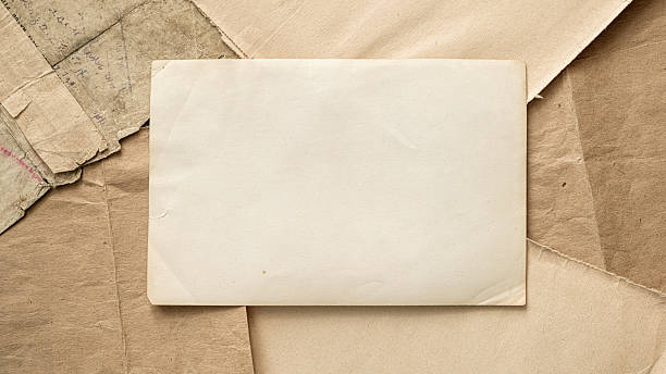 Collection of old papers showcasing blank copy space nestled among various textured sheets of antique documents.