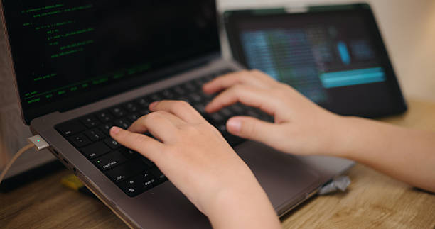 istock A young woman's hands are typing on a laptop. 2234623820