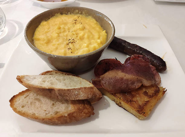 istock Buffet Breakfast Plate with Scrambled Eggs, Bread, and Sausage 2234625214