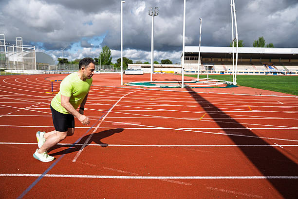 Starting blocks on track for running with hurdles. Sports and competition concept.