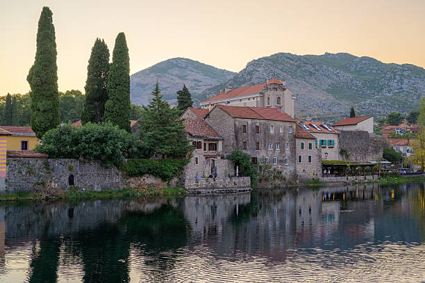 istock Historical architecture reflects in serene waters of Trebinje at twilight 2234627276