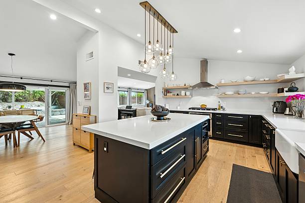 istock Bright modern kitchen with center island, pendant lighting, and open concept design in a luxury home 2234628611