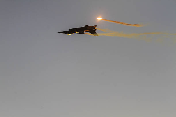 An F-16 Fighting Falcon executes a dynamic solo flight maneuver during an airshow, showcasing speed, agility, and precision in the skies.