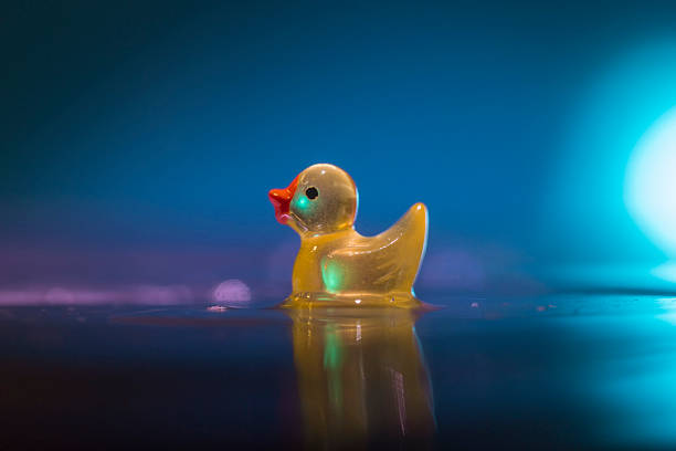 Yellow rubber duck with bubbles and bokeh. Bathtime!