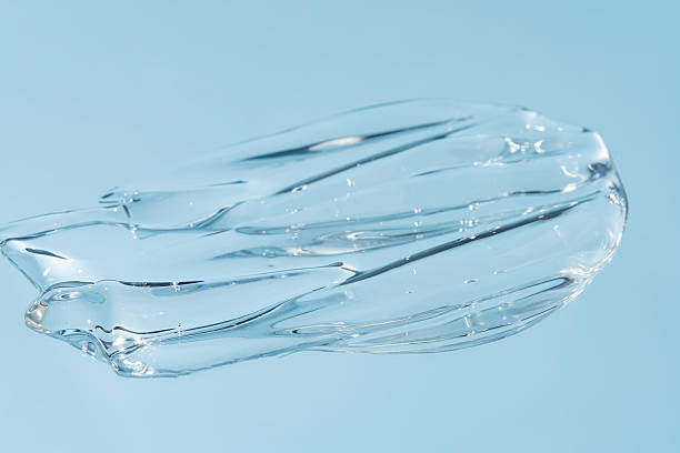 istock Glycerin gel texture. Transparent serum drop on blue background. Liquid gel moisturizer with bubbles macro. 2234634113