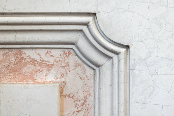 Detailed view of a decorative marble and stucco element in classic architecture, showcasing intricate craftsmanship, colors, and textures for design inspiration, architecture themes, and decor