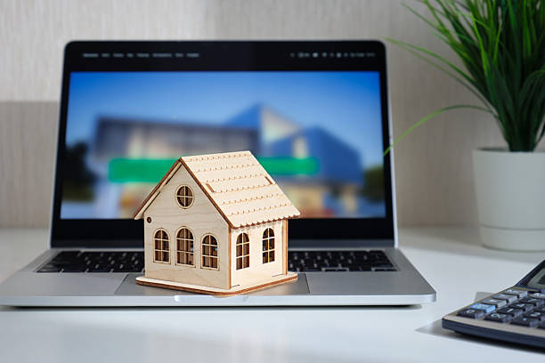 istock Real estate concept with miniature house. 2234635025