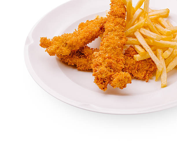 Crispy fried chicken tenders served with golden French fries