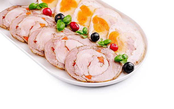 istock Culinary platter featuring savory rolled meats with colorful garnishes 2234637465