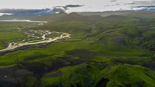 istock Aerial View of Iceland's River System and Moss Covered Hills 2234637476