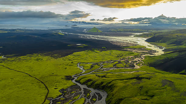 istock Aerial View of Iceland's Mossy Terrain, Rivers, and Triangular Mountain 2234637959