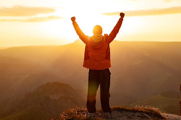 istock Mid adult man at sunset looking at view 2234638314
