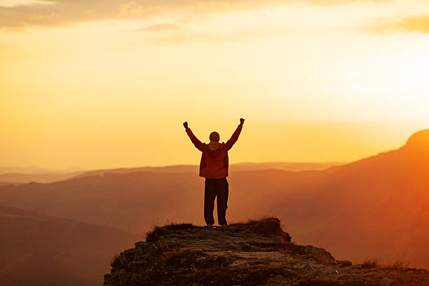 istock Mid adult man at sunset looking at view 2234638329