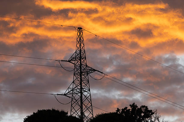 istock High voltage pylons against the sky during sunset, 2234638996