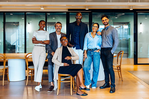 istock Group of professionals posing together in creative office 2234639020