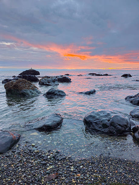 istock Sunset Over the Pacific Ocean and Rocky Shoreline 2234639657