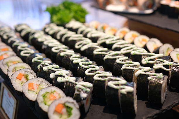istock buffet beautiful food presentation serving culinary art, creating an appealing presentation of japanese cuisine. Japanese food sushi and rolls macro footage. 2234642761