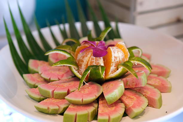 istock pink guava closeup on red guavas cut in basket 2234642929
