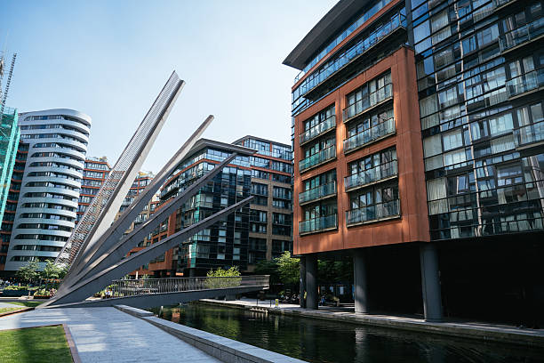Modern skyscrapers in a city skyline featuring glass facades and distinctive architectural designs in Paddington, London