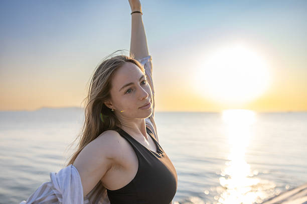 istock Young blonde woman is enjoying summer at sunset. 2234648043