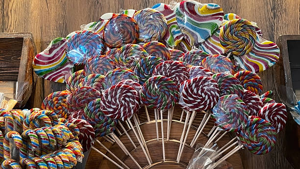 Lollipops in rainbow colors, different sizes, and patterns.