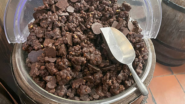 Chocolate chunks filled with peanuts, puffed rice, and walnut pieces.