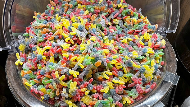 Spider-shaped, colorful jelly beans covered in sugar.