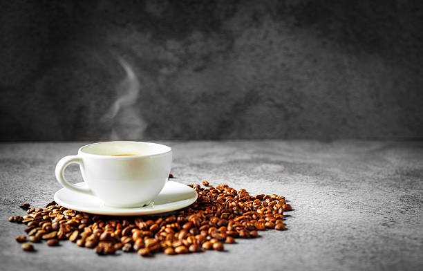 istock Coffee cup and coffee beans on gray background, Espresso crema coffee cup aromatic 2234654143