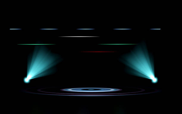 istock Abstract futuristic stage with two teal spotlights illuminating a circular platform on a dark background. Dynamic horizontal light streaks add a modern, technological feel, ideal for presentations. 2234655153