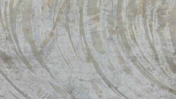 istock Old grey cement floor with stains and scratches, curved stains, walkway, sidewalk, pavement. 2234656854