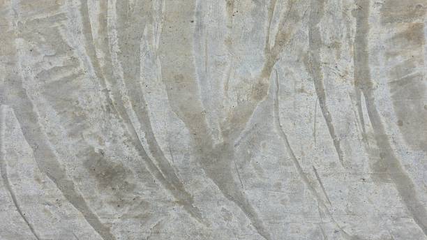 istock Old grey cement floor with stains and scratches, curved stains, walkway, sidewalk, pavement. 2234656855