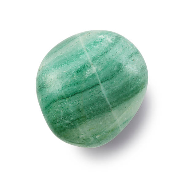 Sample of natural mineral from geological collection - tumbled green Aventurine gemstone isolated on white background