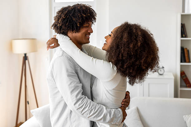 istock Romantic couple hugging each other at home 2234657854