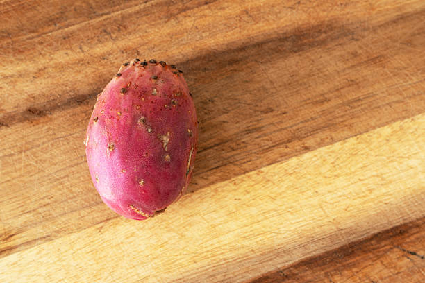 Prickly pear fruit on wood boar. Ripe cactus fruit opuntia