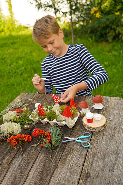 istock Step-by-step instructions on how to make autumn mushrooms from a cardboard egg carton. 2234659167