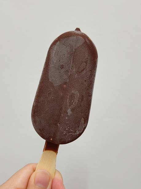 istock Chocolate Covered Almond Ice Cream Bar on Stick 2234660160