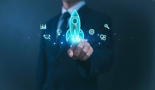 istock Businessman pointing digital rocket icon with innovation, target, handshake, and growth symbols, representing startup launch, business success, entrepreneurship, teamwork, and future strategy. 2234661836