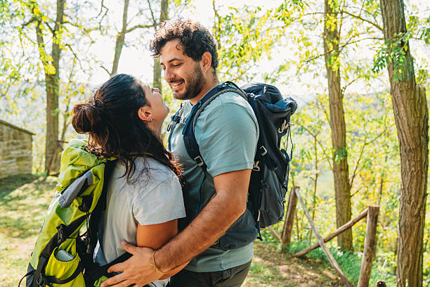 istock A couple is embracing together in the forest while they are taking a break from the hike 2234667733