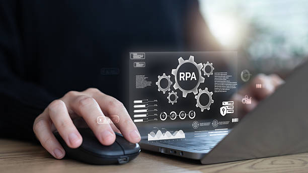 istock Businesses are using a laptop with robotic process automation RPA technology. Concept of digital workflow, AI system, business efficiency, productivity, and modern process automation. 2234671816