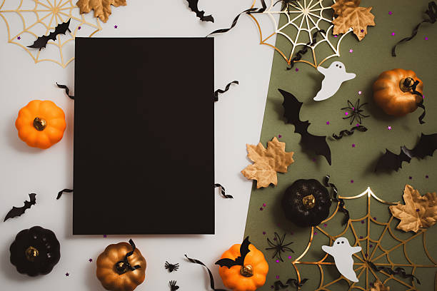 Halloween party template from empty black blank with festive decoration from pumpkins, bats, spider web, confetti on white and green background top view.