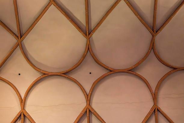 istock Geometric wooden ceiling design with intricate curved patterns 2234673016