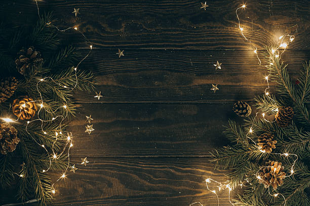 istock Christmas wooden background with fir tree branches and cones 2234673046