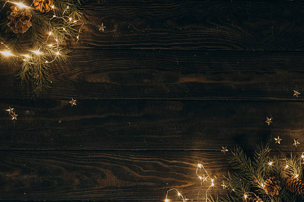 istock Christmas wooden background with fir tree branches and cones 2234673047