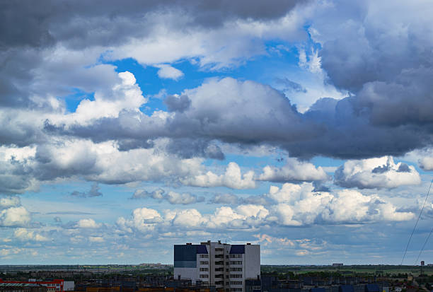 istock Cloudy sky over city apartment buildings 2234673987