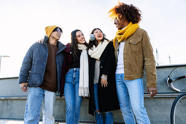 istock Happy multi-ethnic friends laughing together on winter day 2234675557