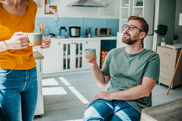 istock Enjoying coffee and conversation in a bright domestic kitchen with friends during a relaxing afternoon 2234675599